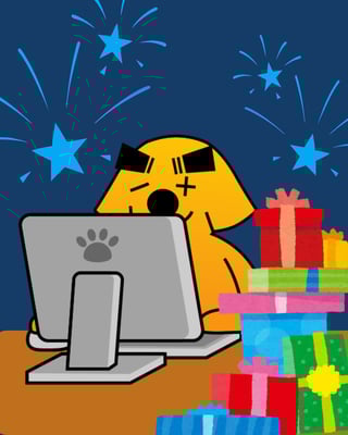 Image of Sumdog sat at a computer surrounded by presents